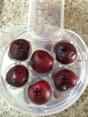 Cherries after being pitted. Notice the cross hatch where the blade goes through.